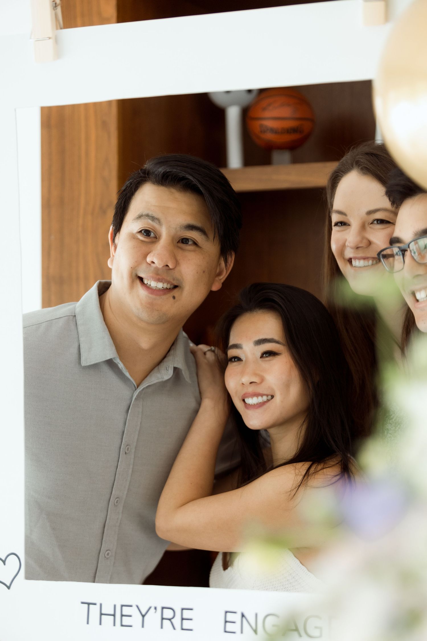 Engagement announcement photo with couple sharing intimate moment.