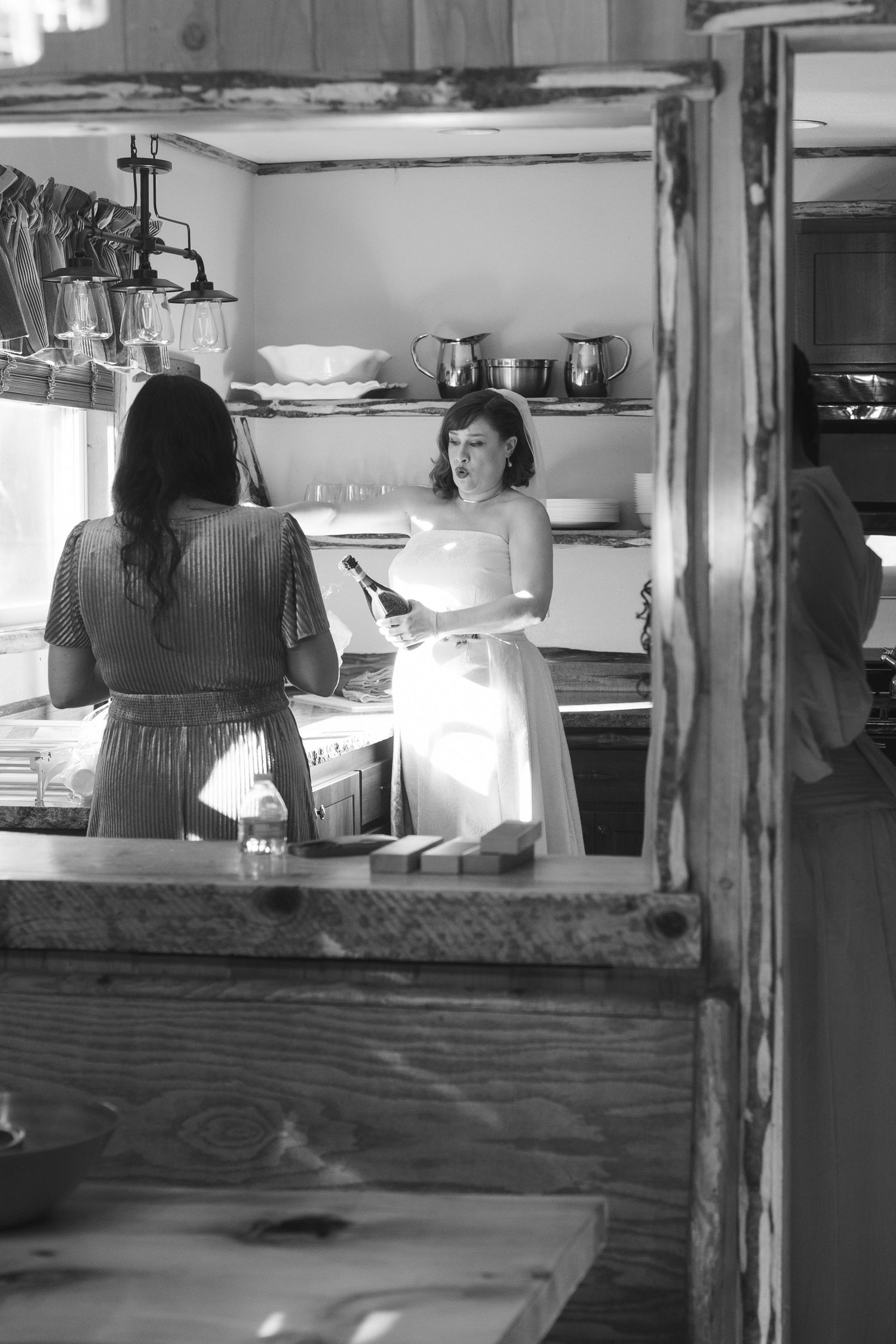 Black and white view through window of counter service area.