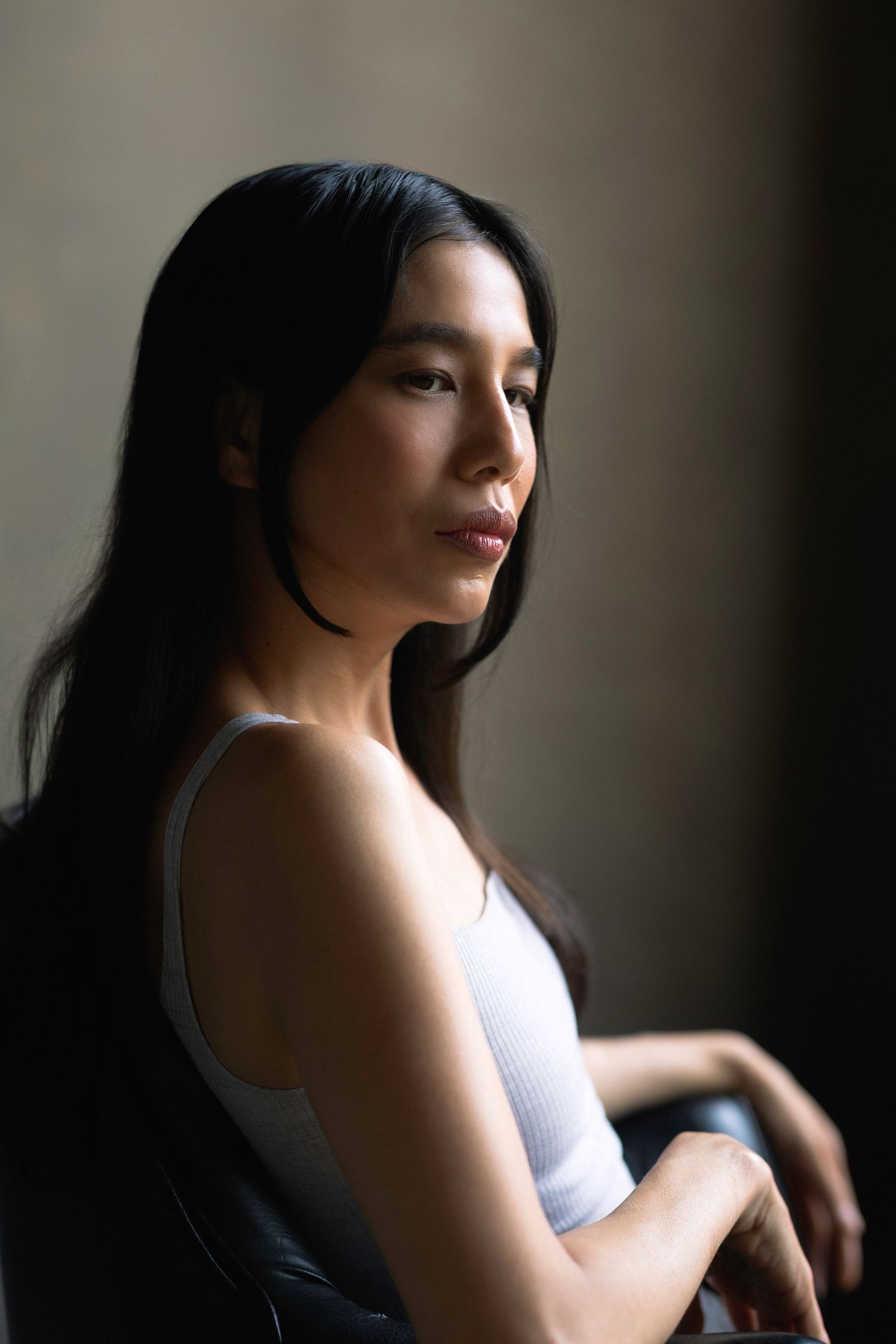 Artistic portrait series showing dramatic lighting and shadows.