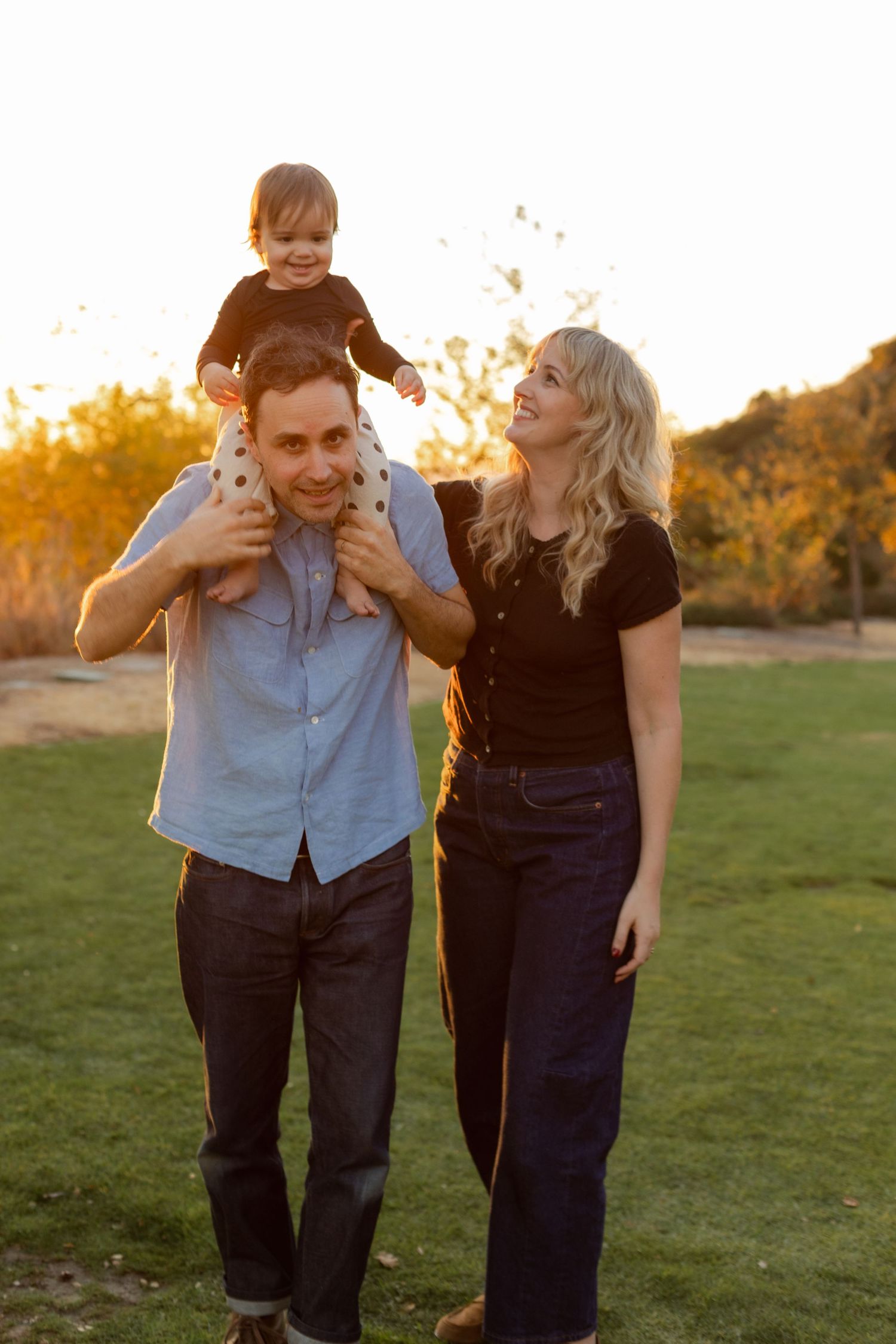 Playful family moments captured in sequence during a sunset photoshoot in a grassy field.