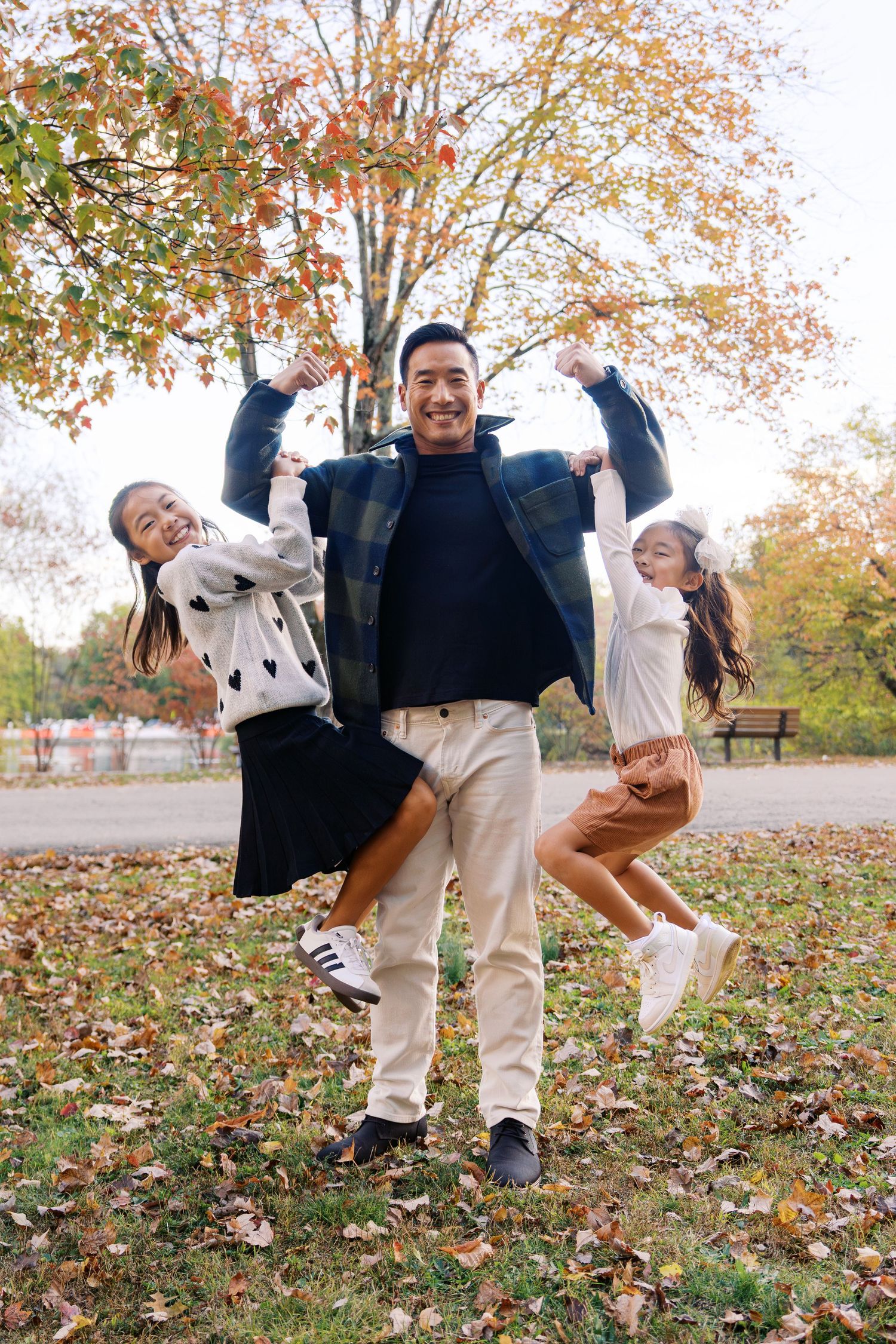 Dynamic action shots of family members jumping and playing in autumn leaves.