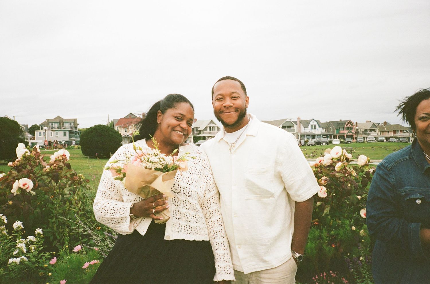 A romantic outdoor celebration with elegant white lace and floral decorations.