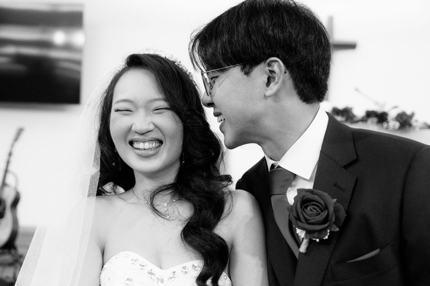 Black and white candid wedding moments showing joy and laughter during the celebration.