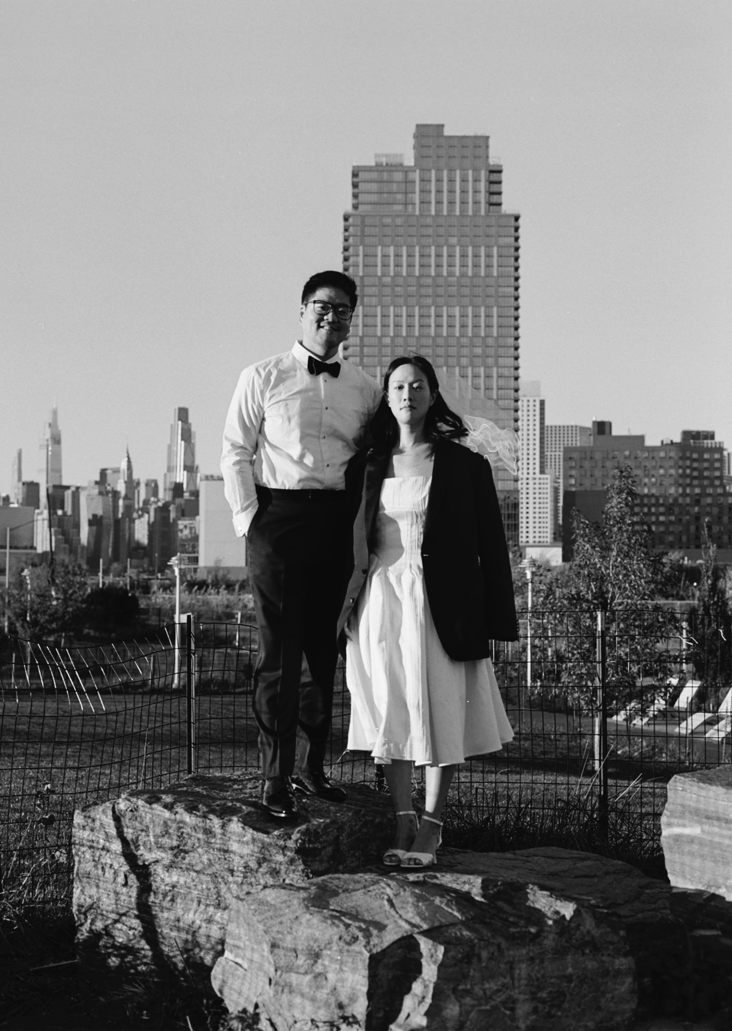 Black and white cityscape series with urban buildings in background.