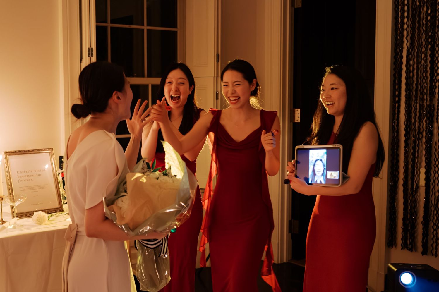 An intimate indoor celebration with warm lighting and elegant decor.