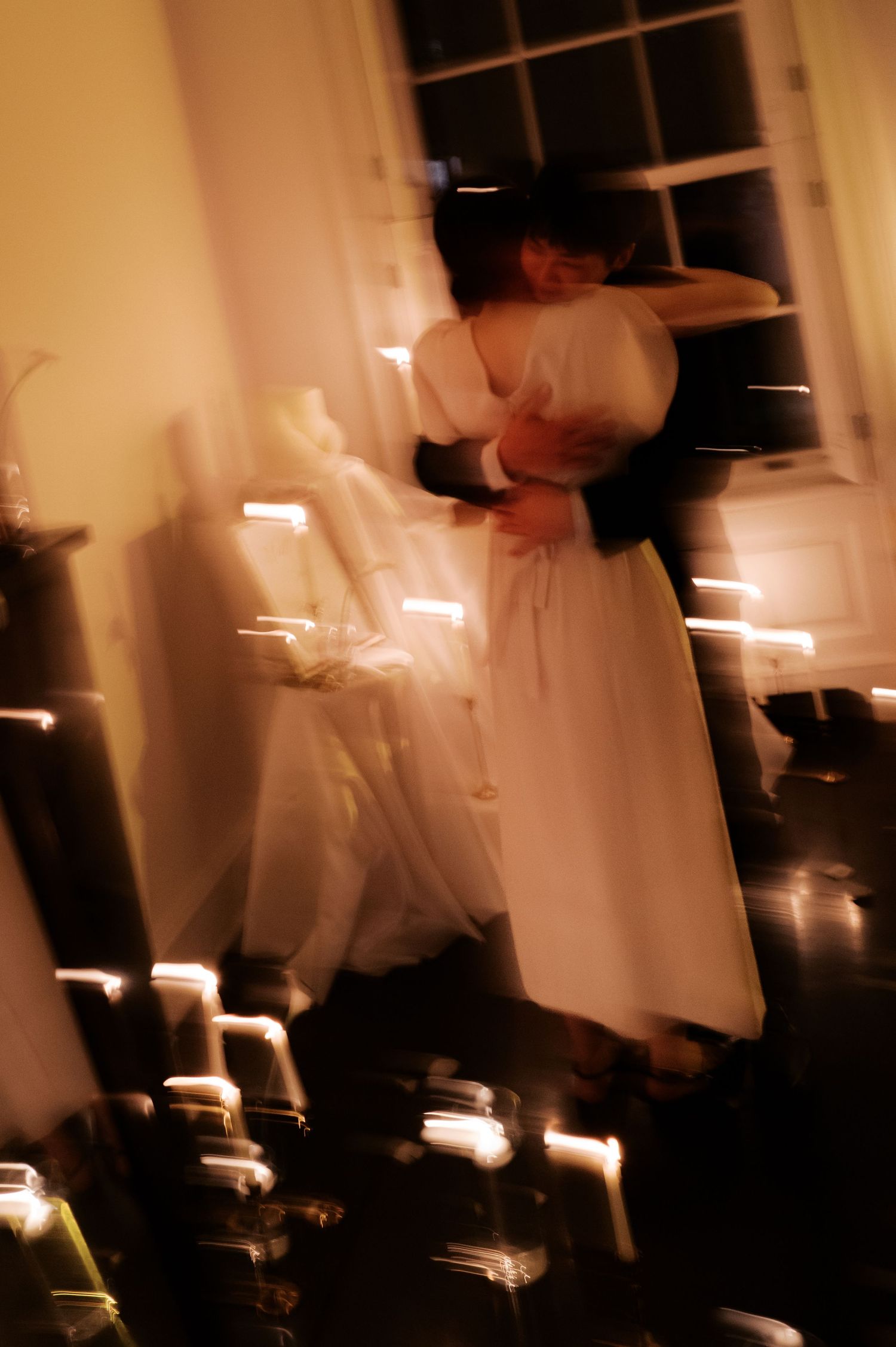 A romantic candlelit scene with soft glowing lights creating an intimate atmosphere.