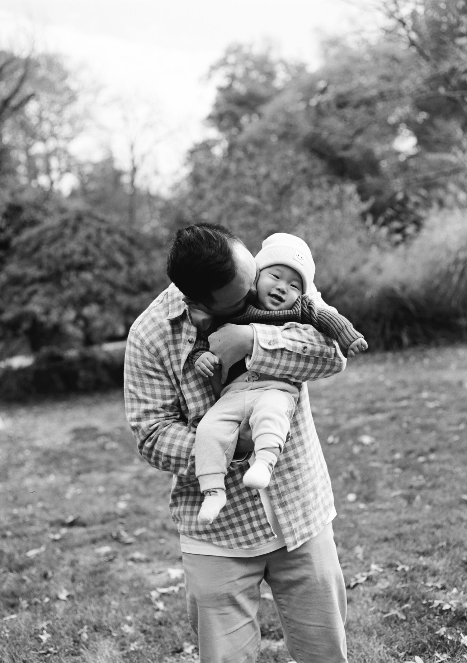 Black and white photos of playful interactions in an outdoor setting.