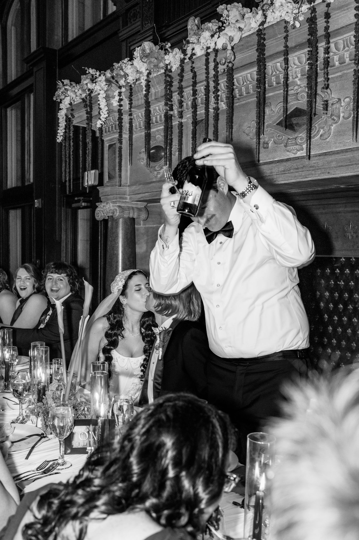 Wedding party celebrates with energetic dancing during the reception festivities.