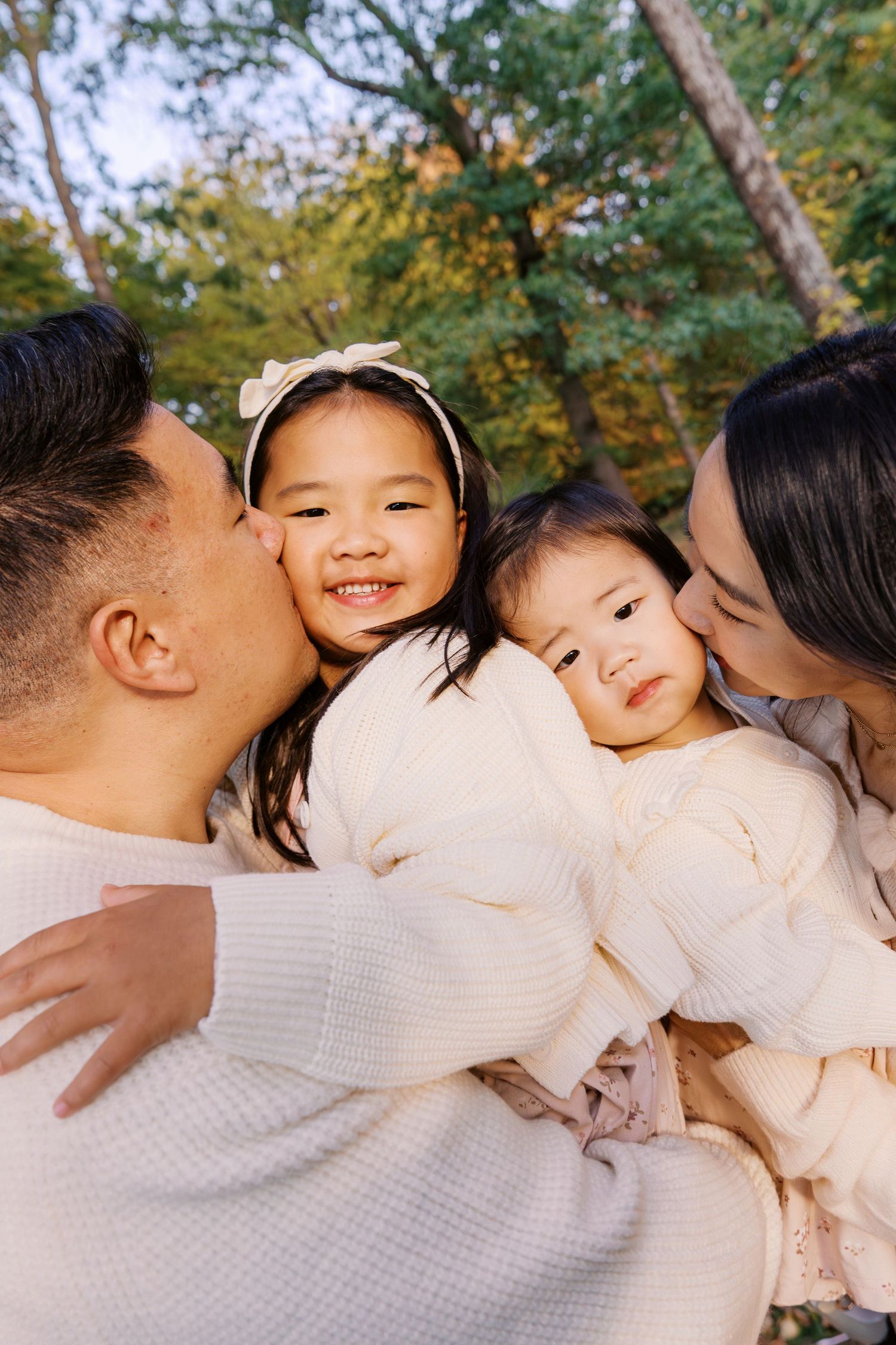 Intimate family moment captured in warm autumn lighting.