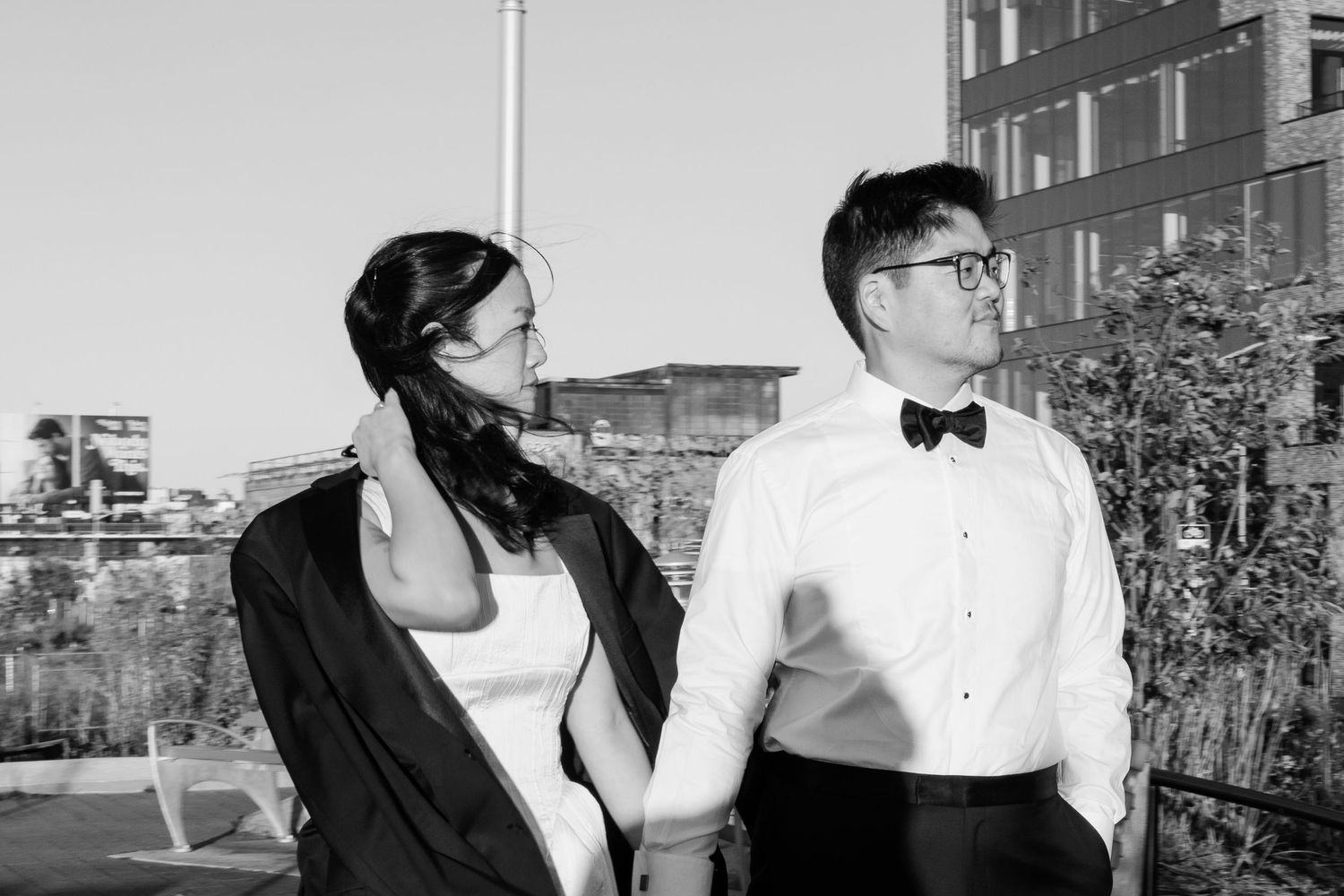A series of black and white romantic photographs showing intimate moments between a couple outdoors.
