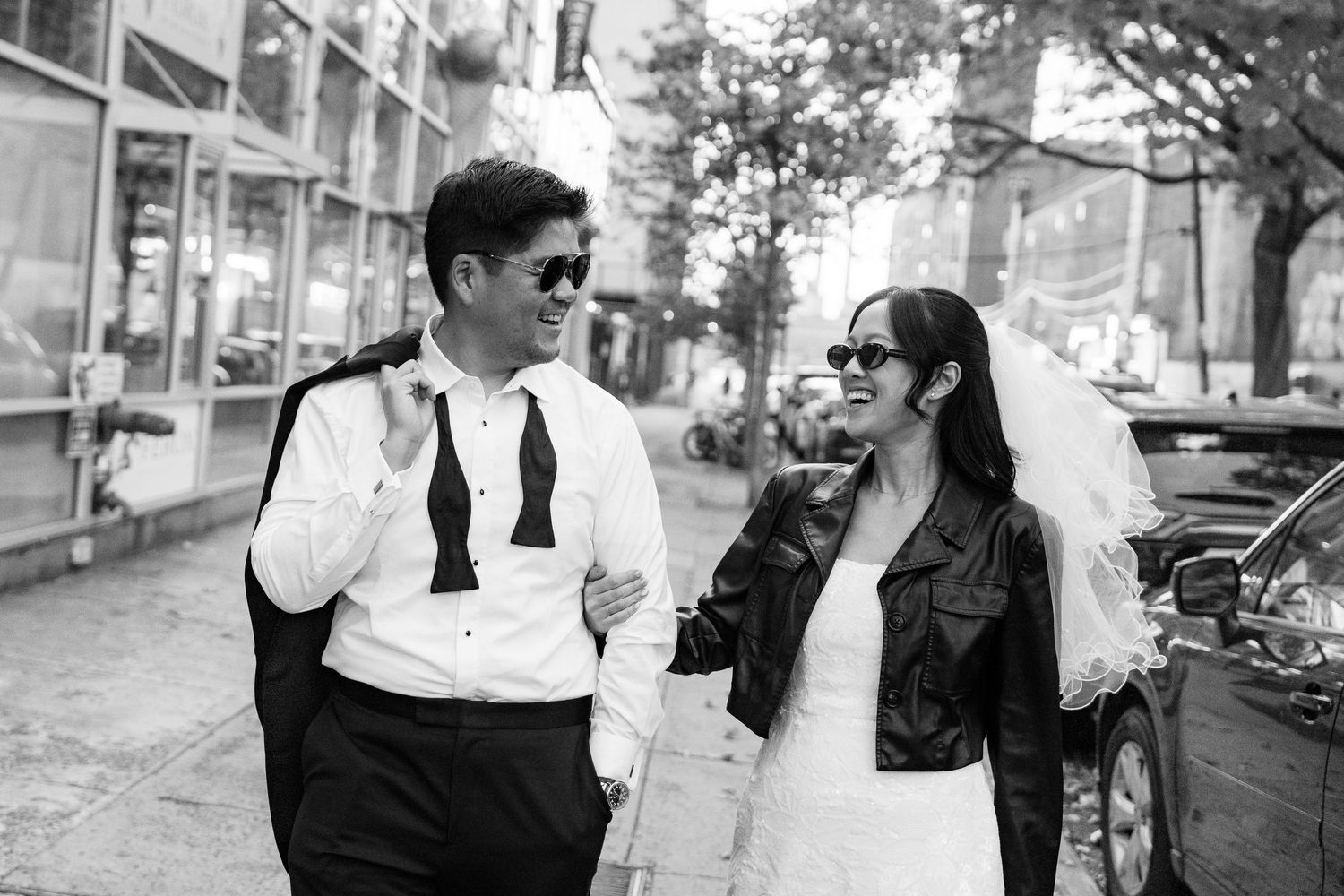 Black and white street photography series capturing casual moments between people.