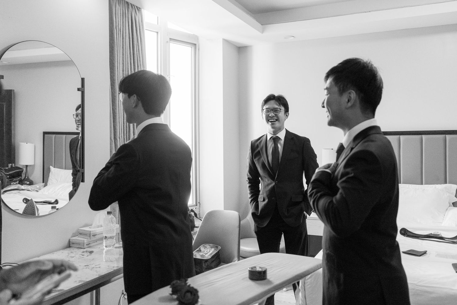 Series of intimate wedding preparation moments captured in black and white.