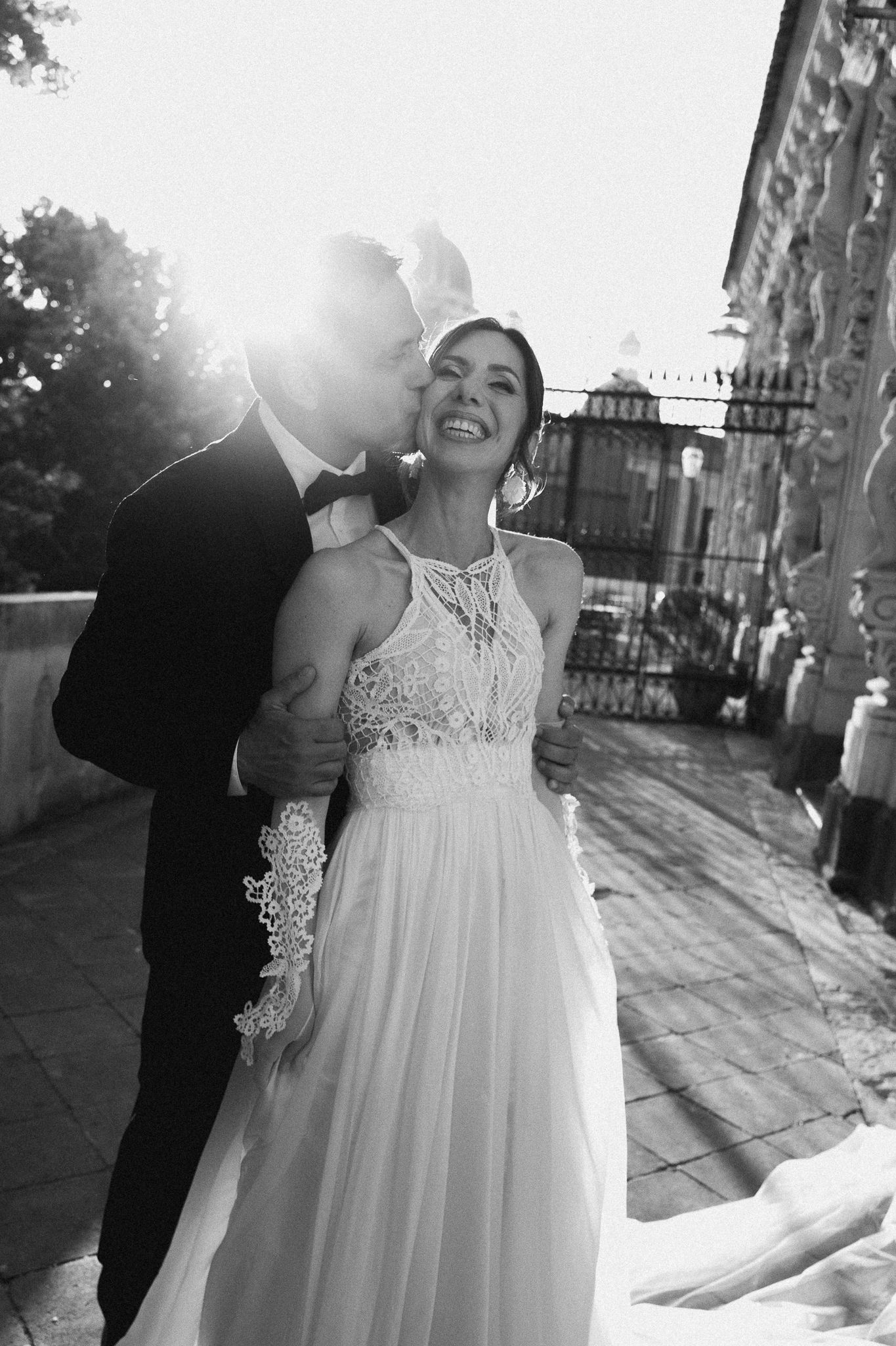 Black and white photo sequence showing a couple dancing in sunlit outdoor setting with elegant attire.