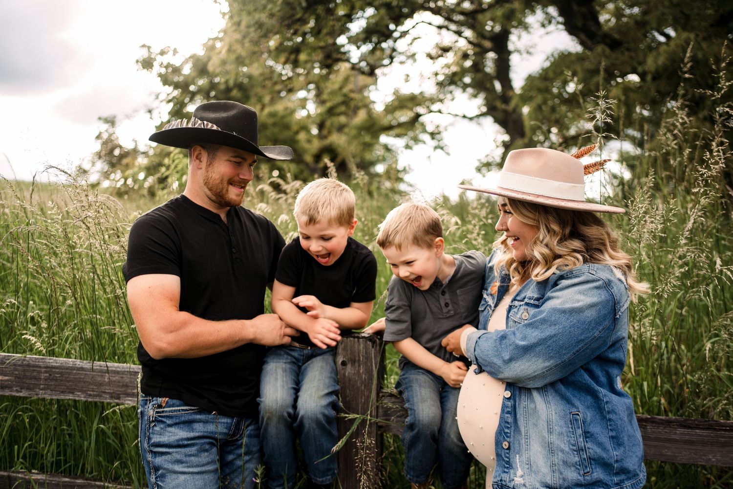 A family shares joyful moments together outdoors on a sunny day.