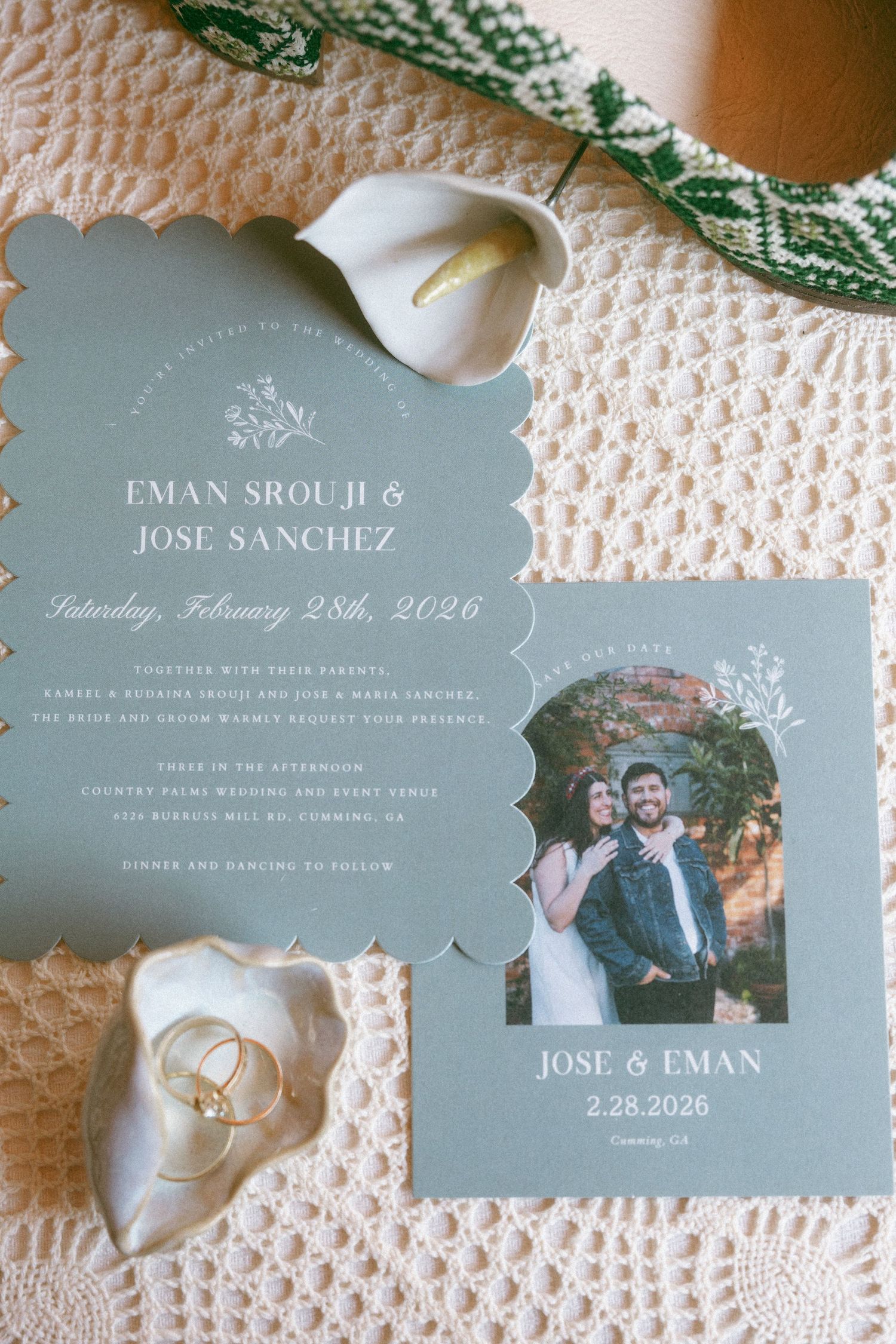 Elegant sage green wedding invitation suite for Eman Srouji and Jose Sanchez with couple photo and gold rings on lace.