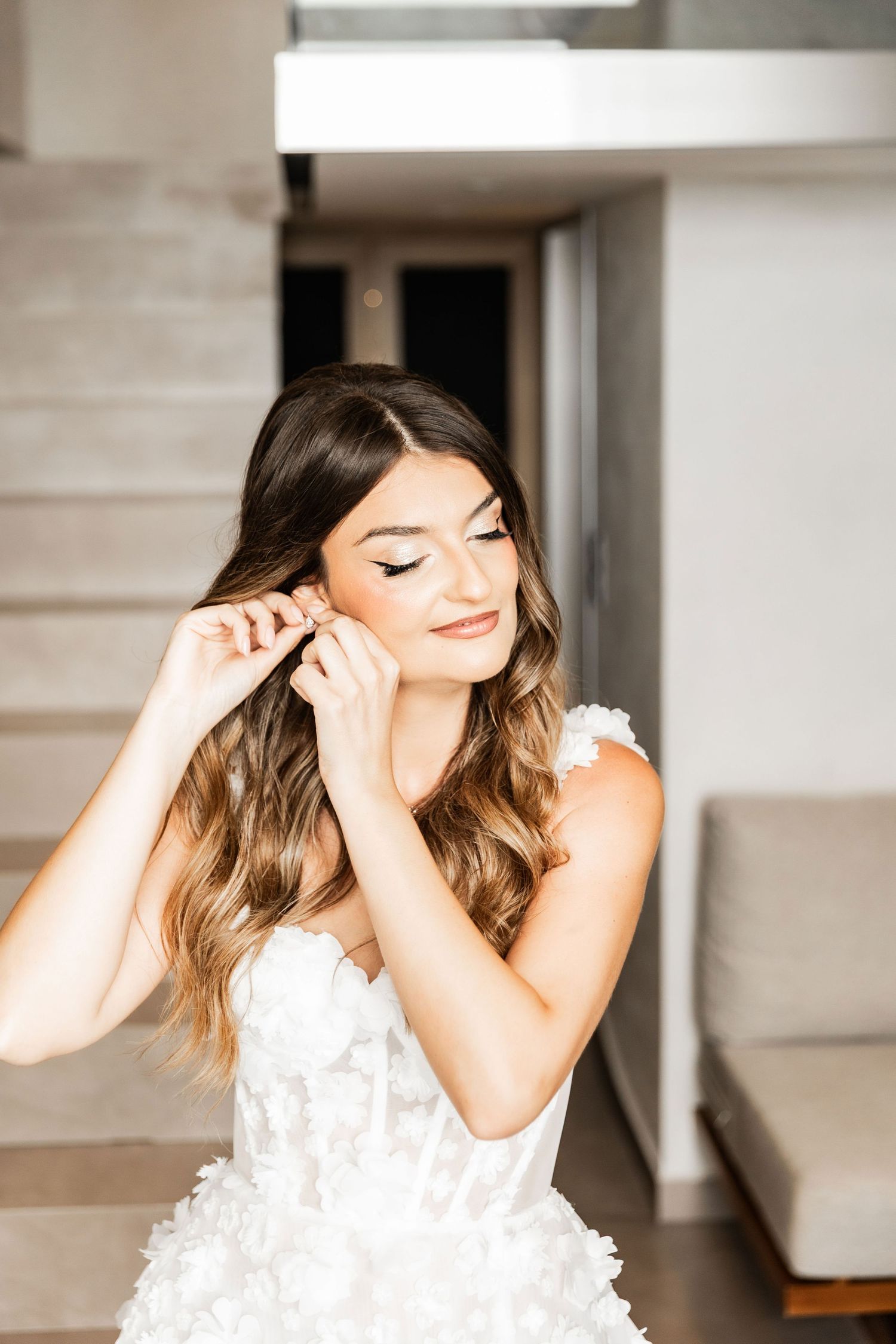 Close-up shots showing delicate details of a white textured dress.