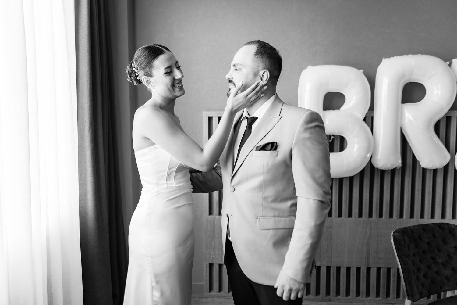 Minimalist black and white wedding preparation photos with architectural elements.