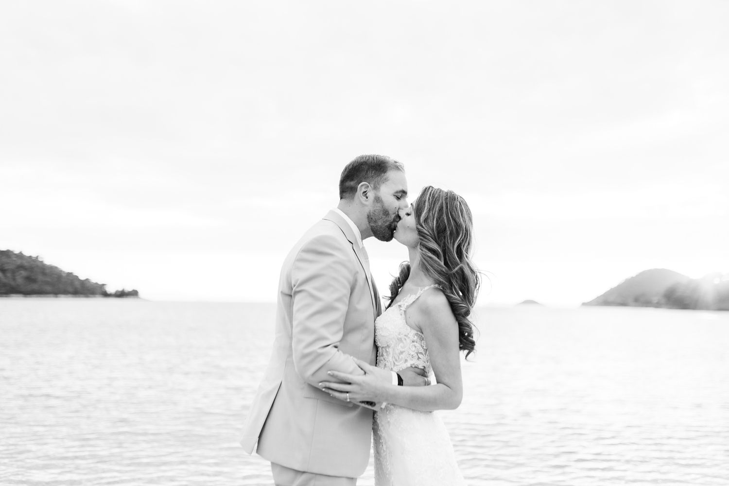 Black and white romantic beach portraits at sunset.