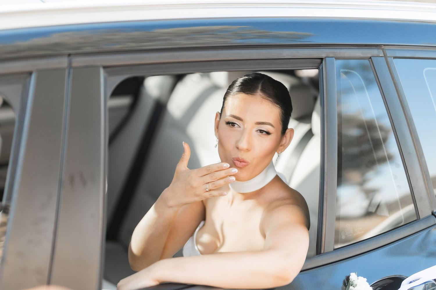 A classic car decorated for a wedding celebration.