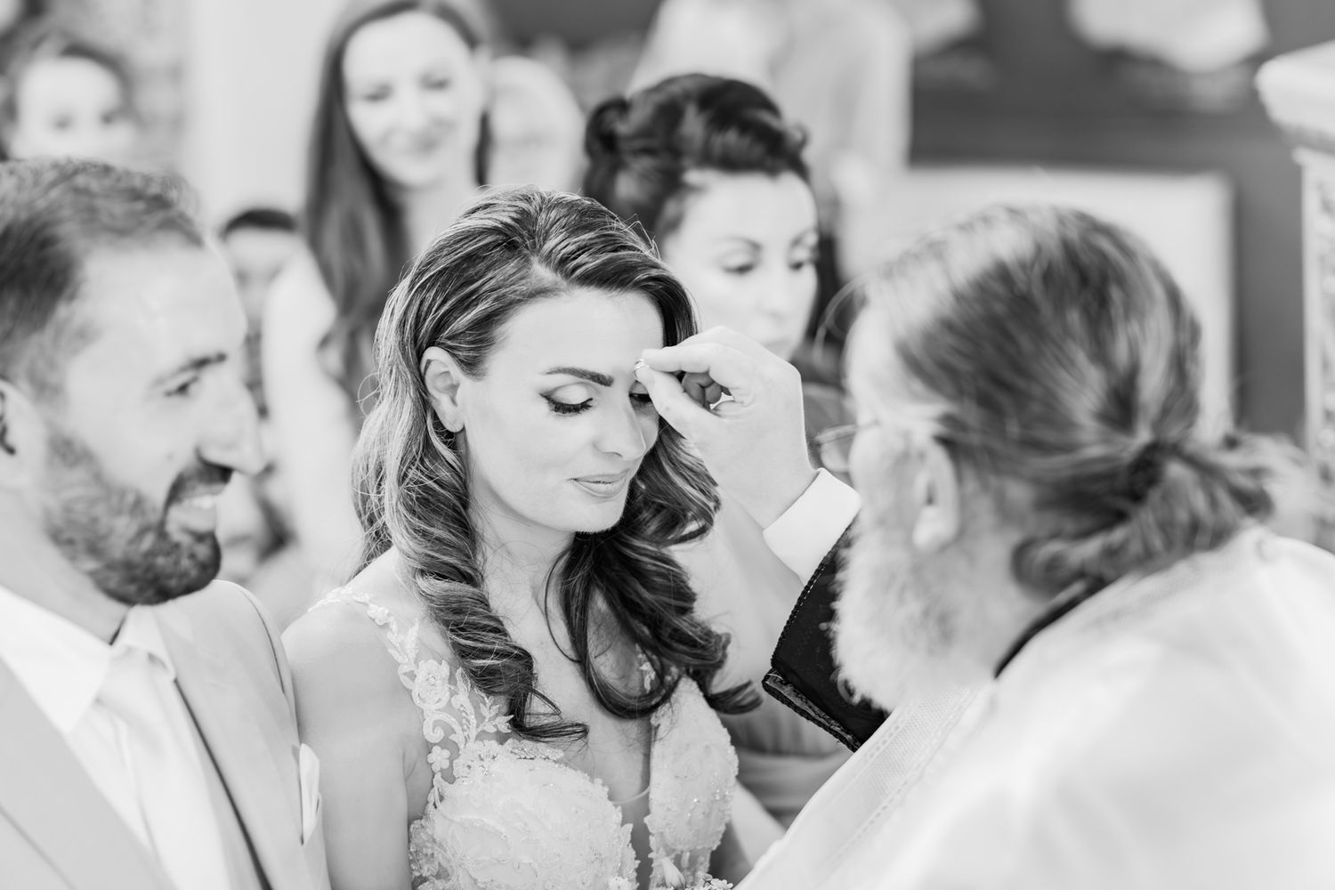 Black and white candid moments from a wedding celebration.