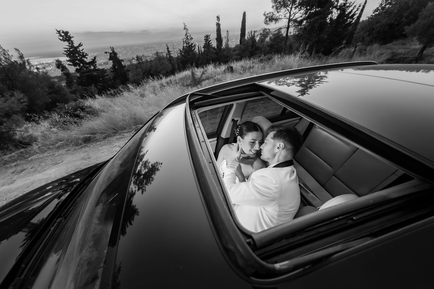 Black and white photos of wedding party departing in classic cars after ceremony.