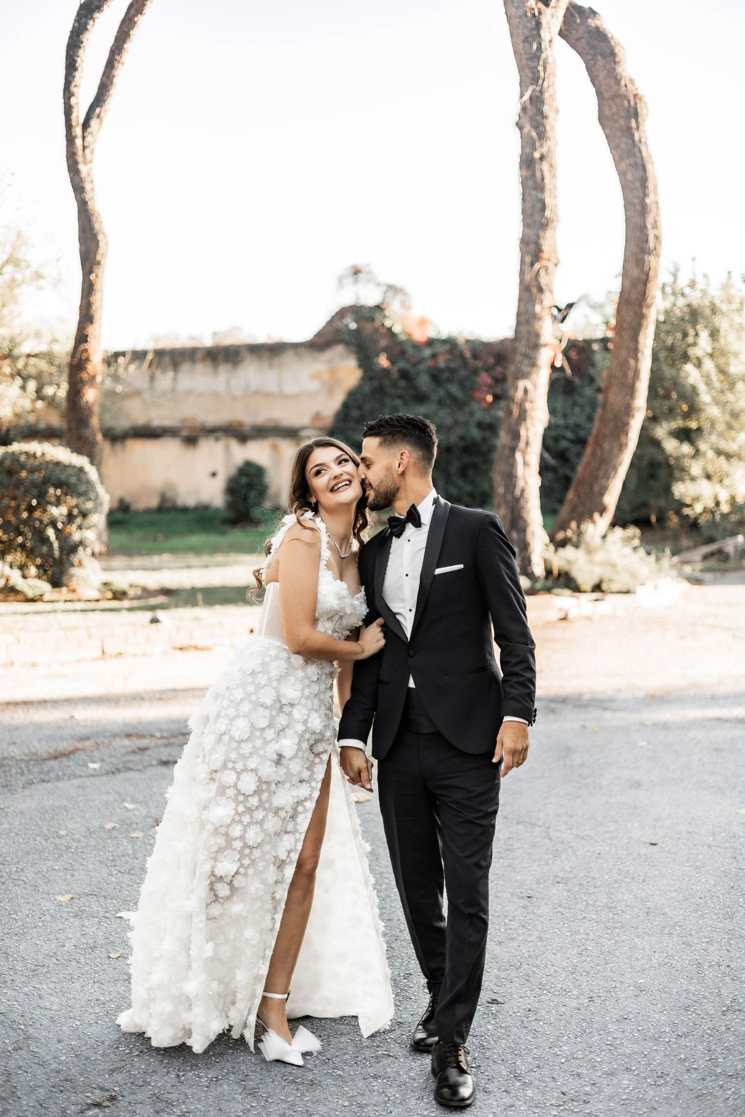Romantic wedding photography session in an outdoor setting with natural lighting.