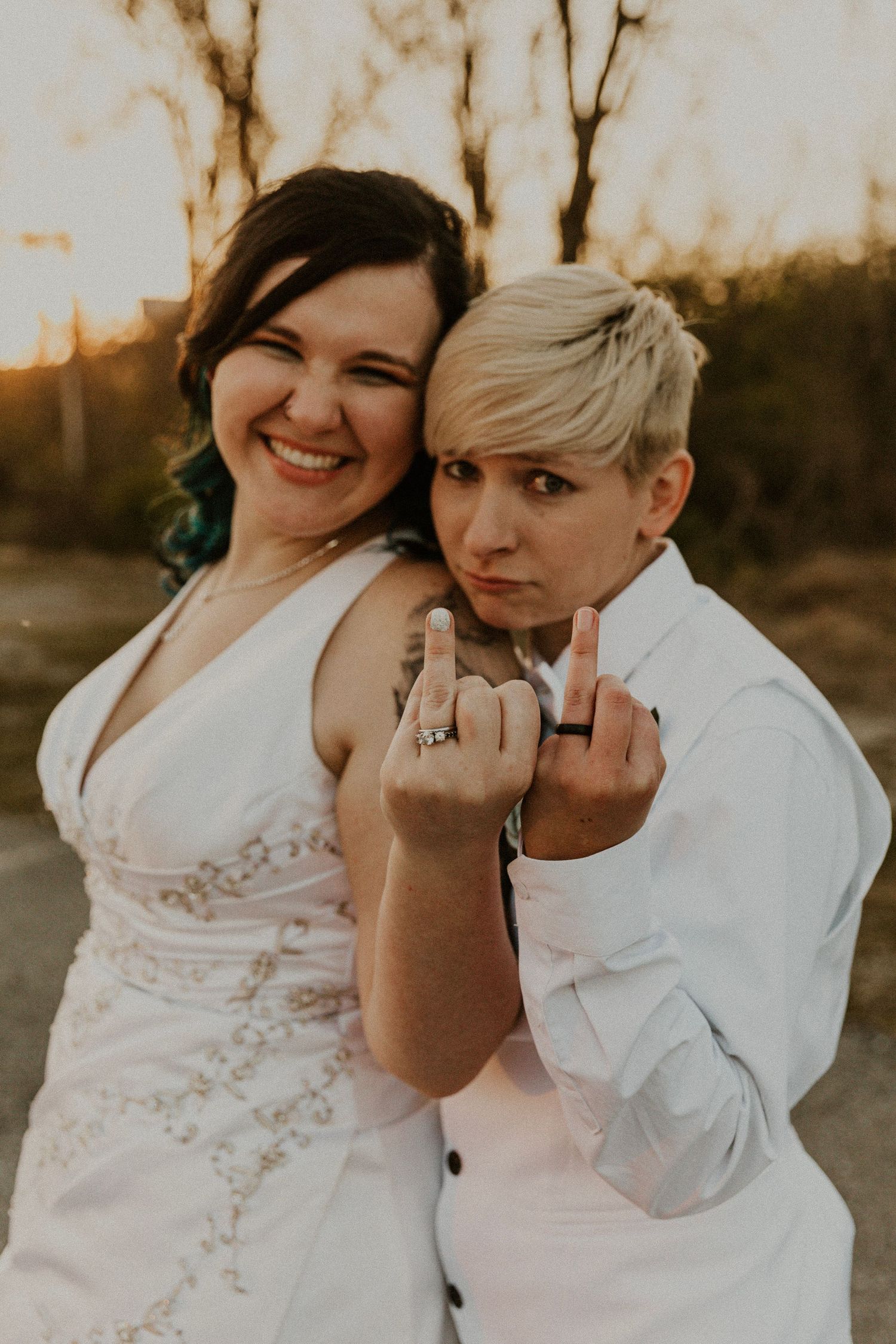 Sunset wedding in Louisville. Couple in wedding attire shows off rings