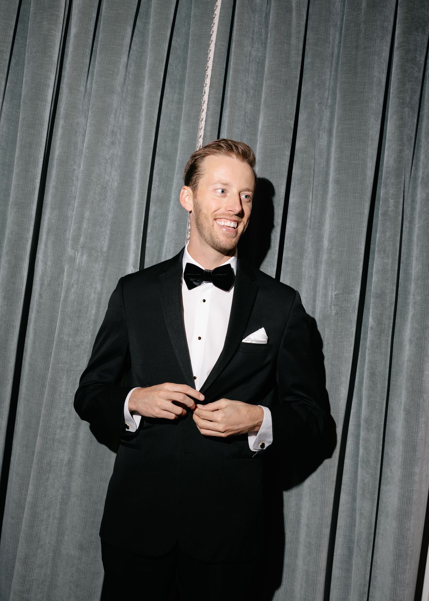 Series of formal photos showing people in tuxedos against a grey curtain backdrop.