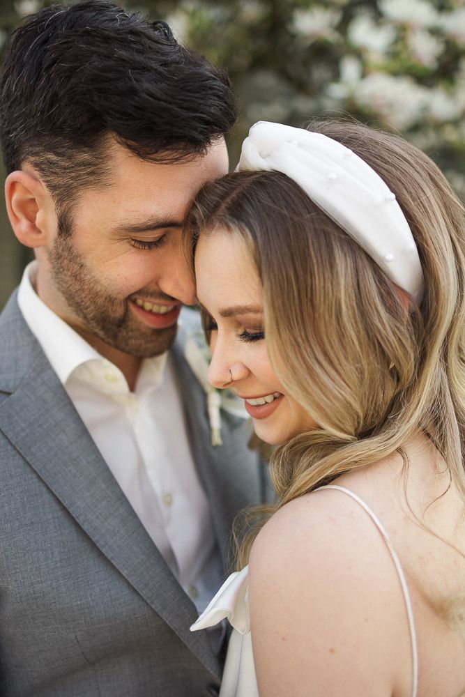 A tender moment captured between a couple during their wedding photoshoot.