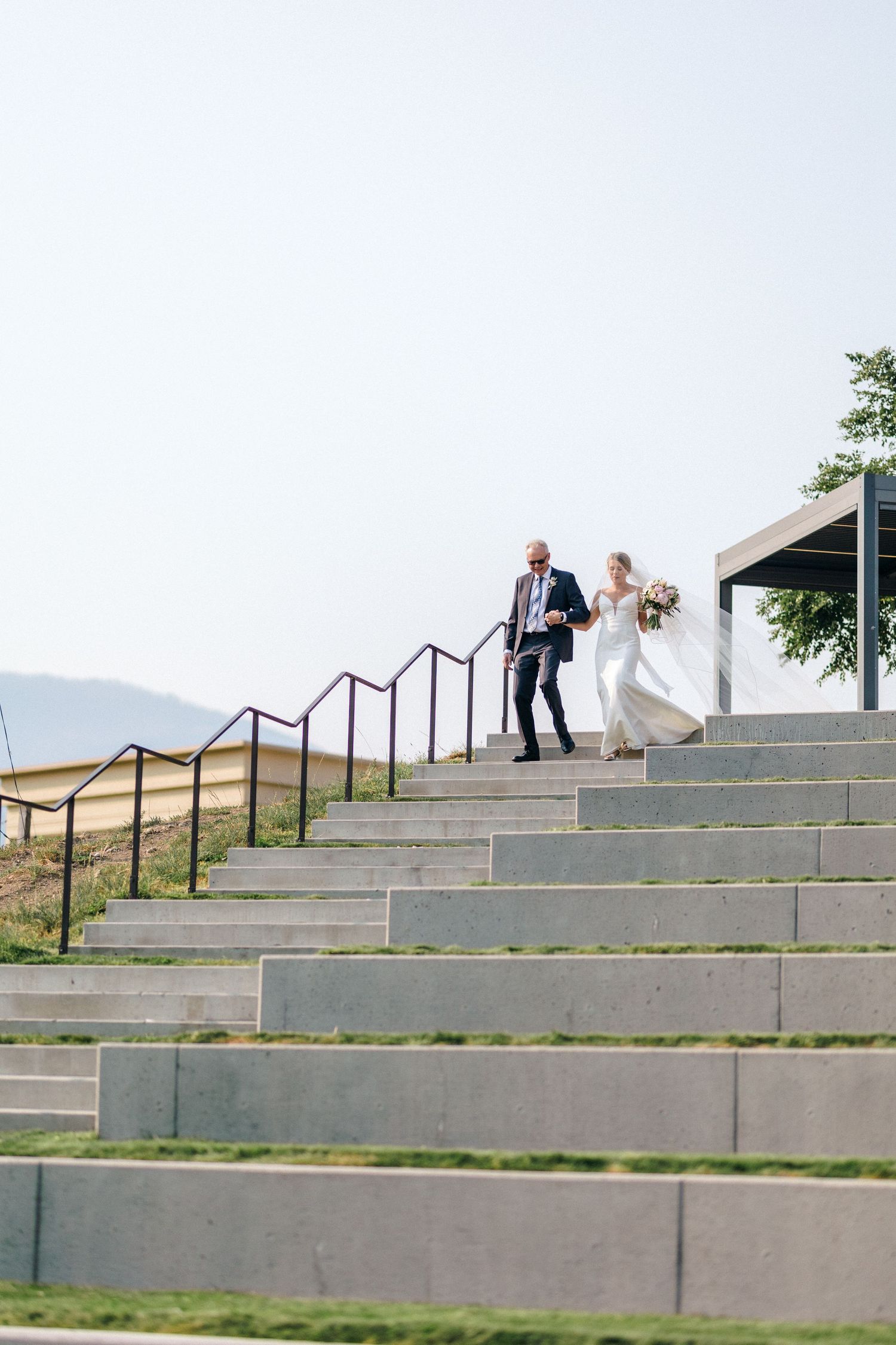 Wedding ceremony steps sequence against a mountain backdrop.