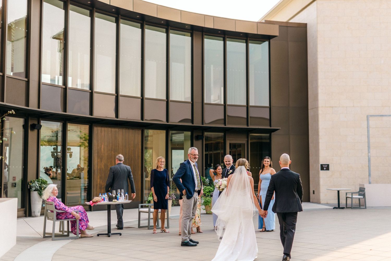Modern architectural exterior of an event venue with large windows and clean lines.
