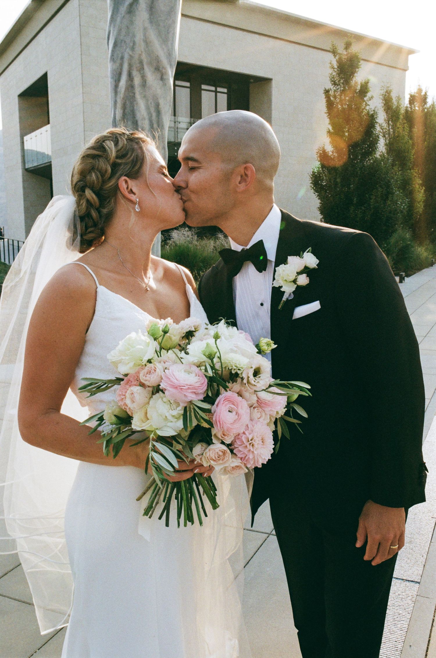 Three romantic moments captured at a beautiful outdoor wedding with elegant bouquets of pink and white flowers.