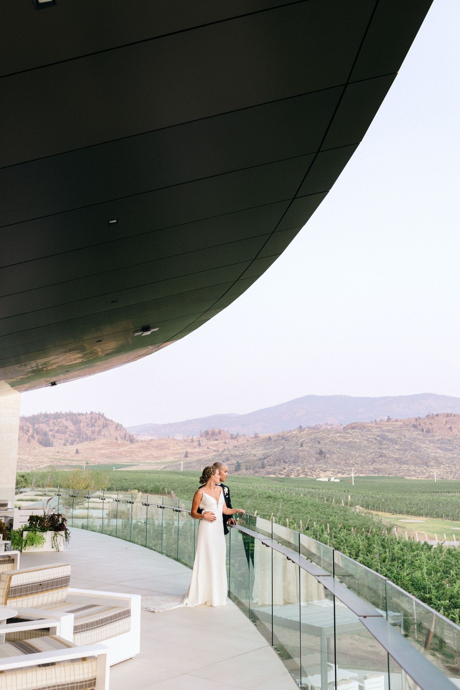 A scenic balcony overlooking desert mountains with modern architectural details.