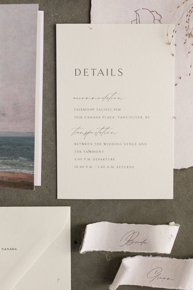 Wedding details card with elegant typography and event information on white paper.