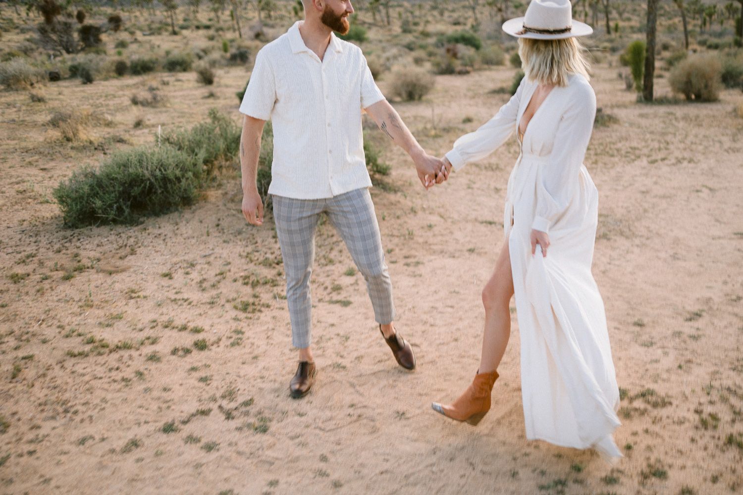 A playful desert dance captured among Joshua trees and mountains.