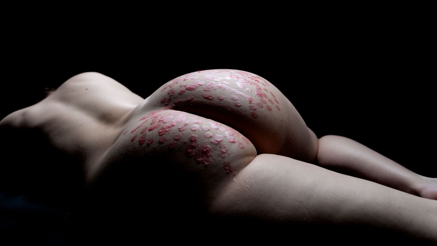 Artistic black and white macro photography series showing delicate details of human skin with intricate patterns and textures.