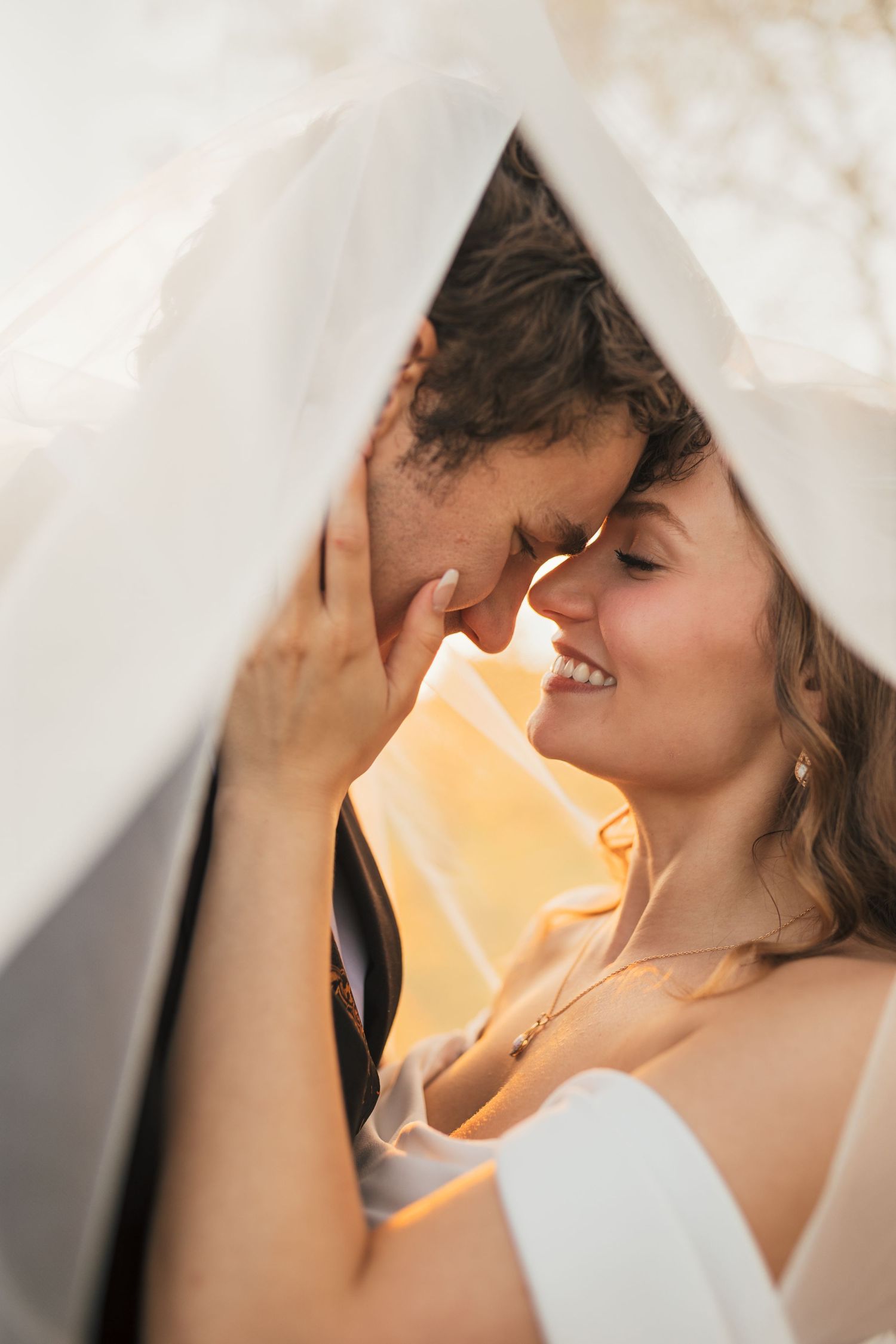 A romantic couple shares an intimate moment under soft lighting, with multiple similar poses shown in sequence.
