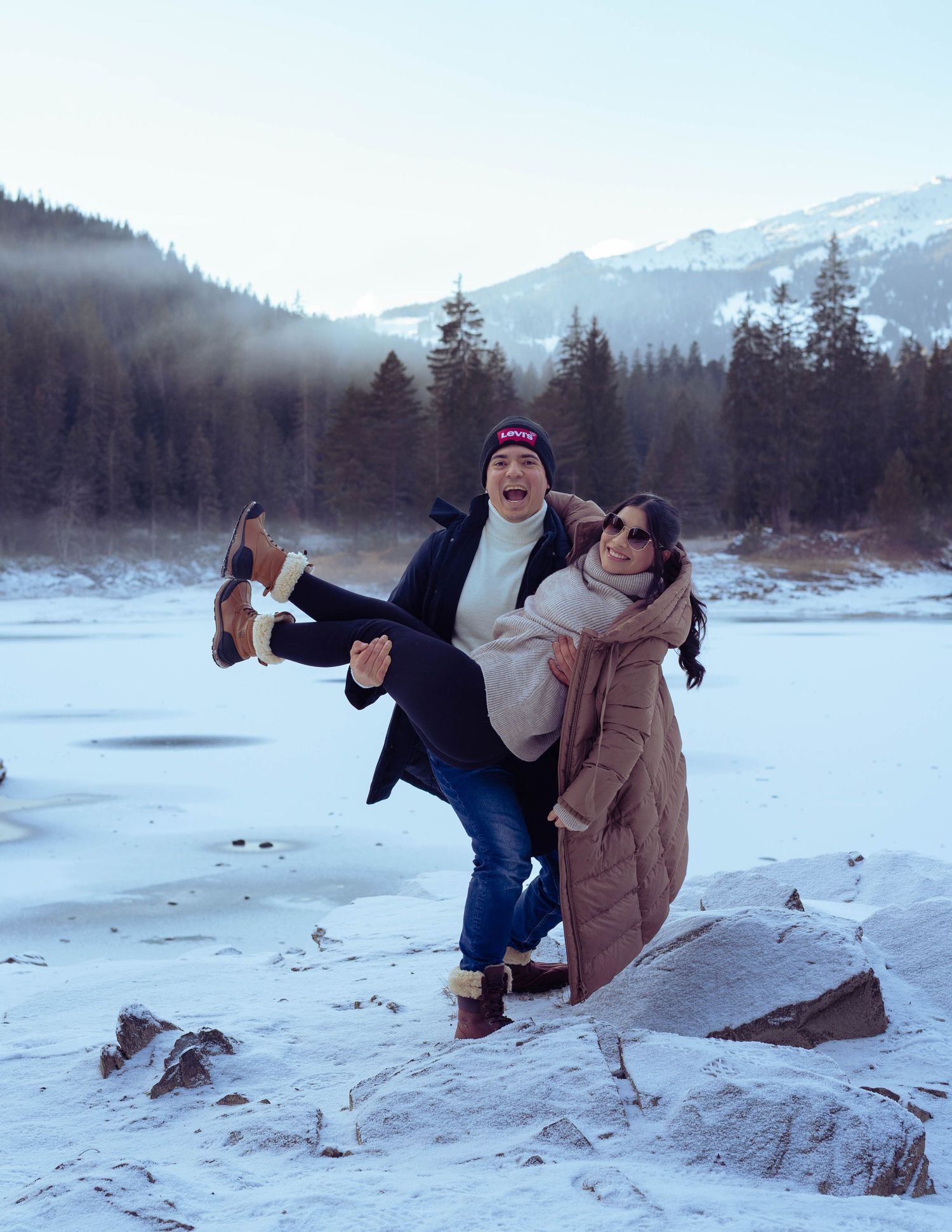 Exclusive couple photoshoot in the snow. Fashion-inspired editorial Flims, Caumasee. Joseph Bejaran.