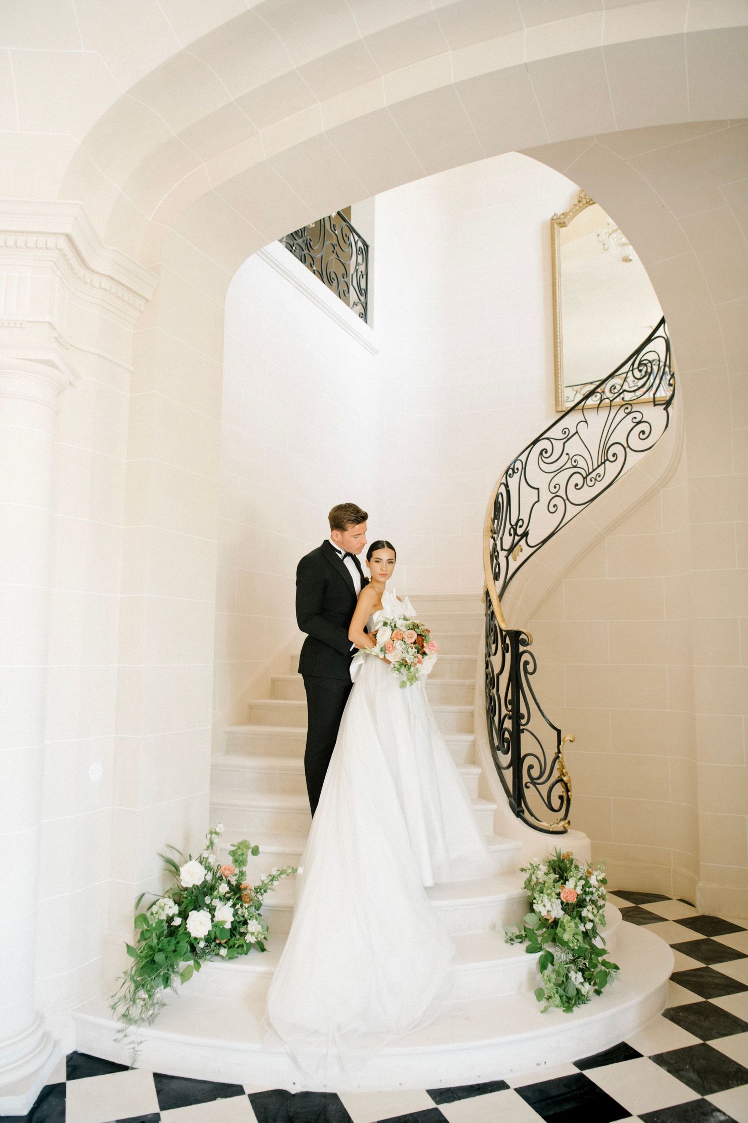 Couple on a staircase in French Chateau