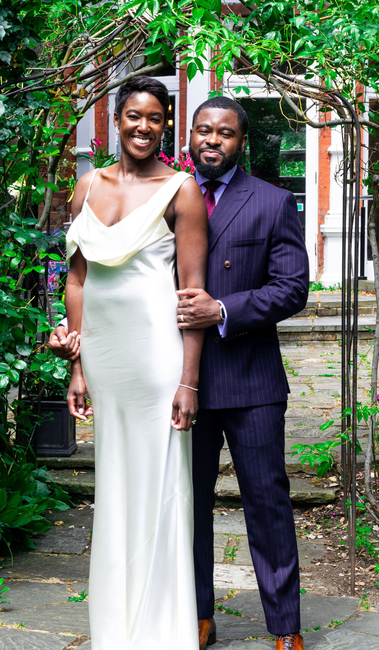 A bride and groom smiling at their civil wedding