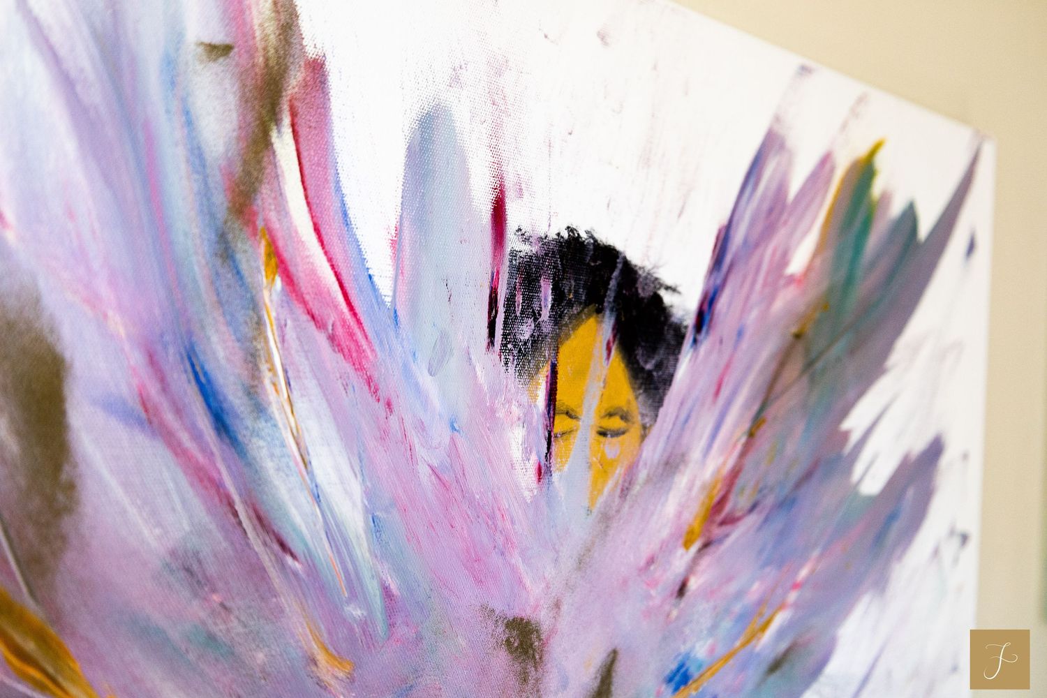 An abstract painting by Sara Pang with a girl behind a splattered rainbow colored spread.