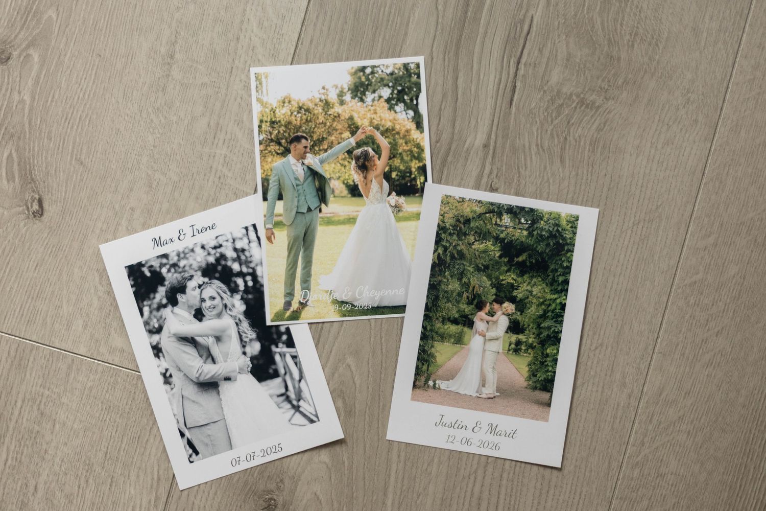 Three Polaroid-style wedding photos arranged on wood floor, featuring couples in formal attire in garden settings.