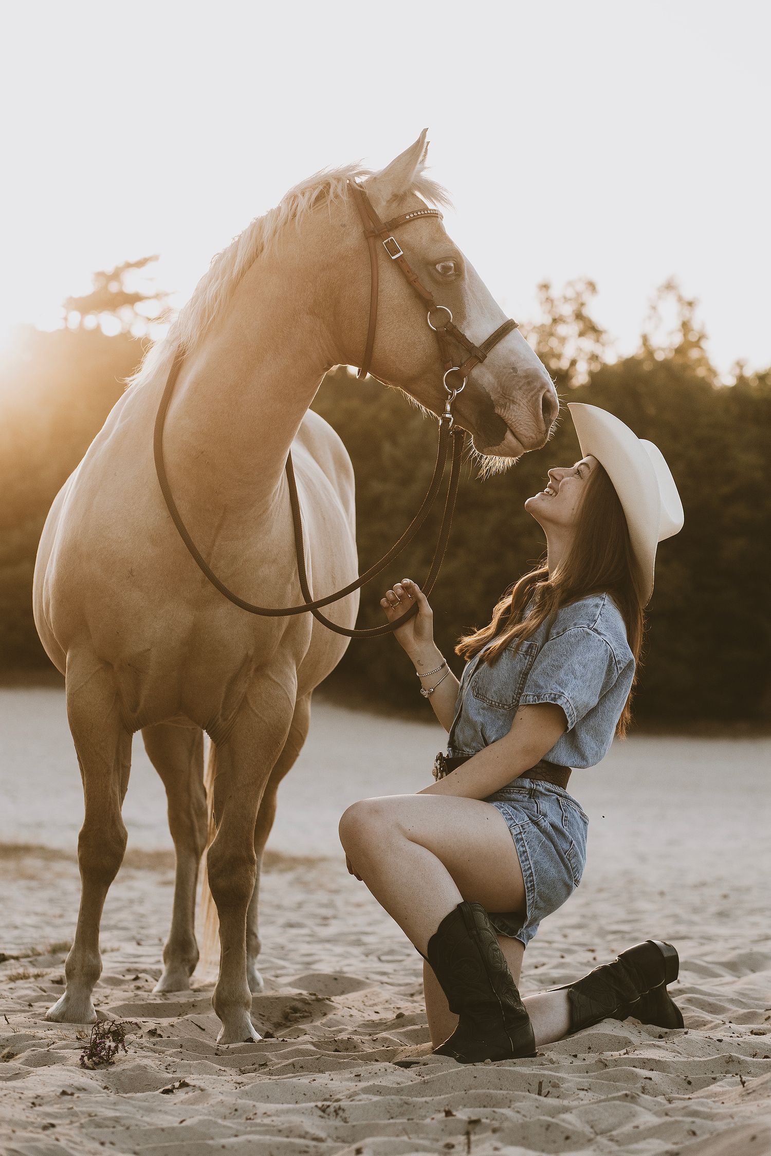 A series of artistic beach photos showing a person in denim shorts interacting with a brown horse at sunset.