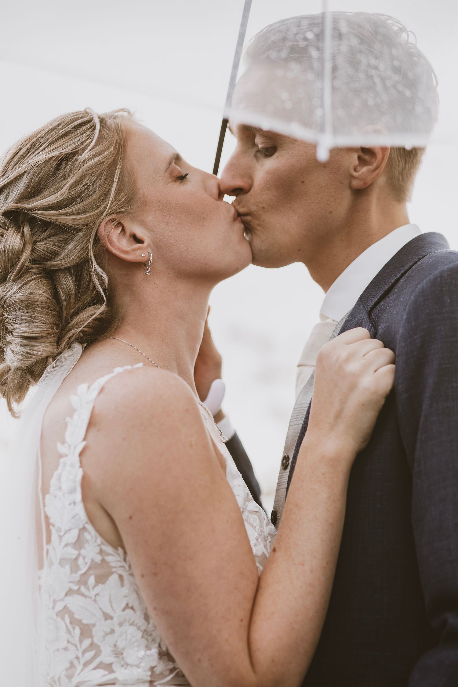 A romantic wedding photo sequence showing a couple sharing a tender kiss in black and white tones.