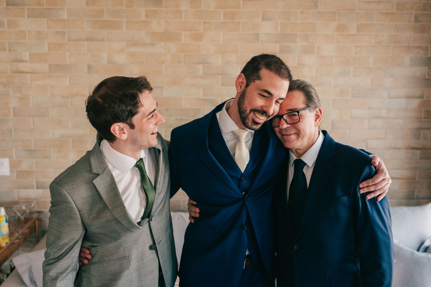 Groom getting ready with father and friends before Botânico Quintal wedding in São Paulo, Brazil.