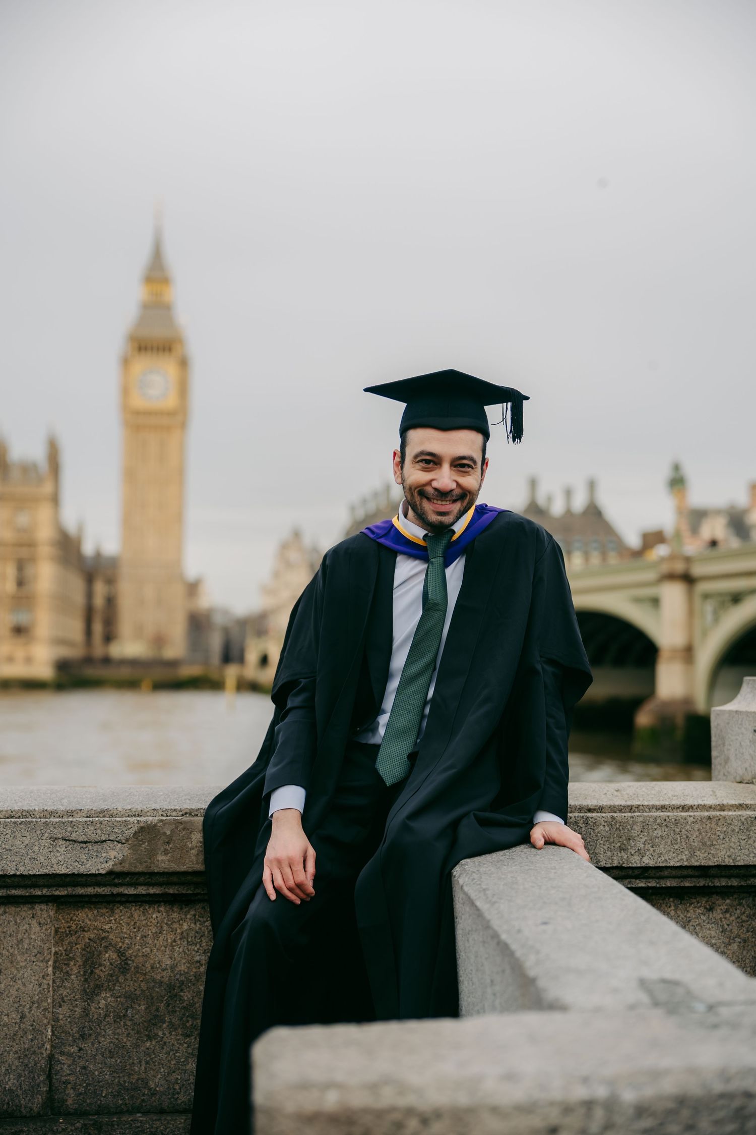 Close-up graduation portrait in London with Big Ben in the background, photographed by London photographer @lyfphotos in Westminster