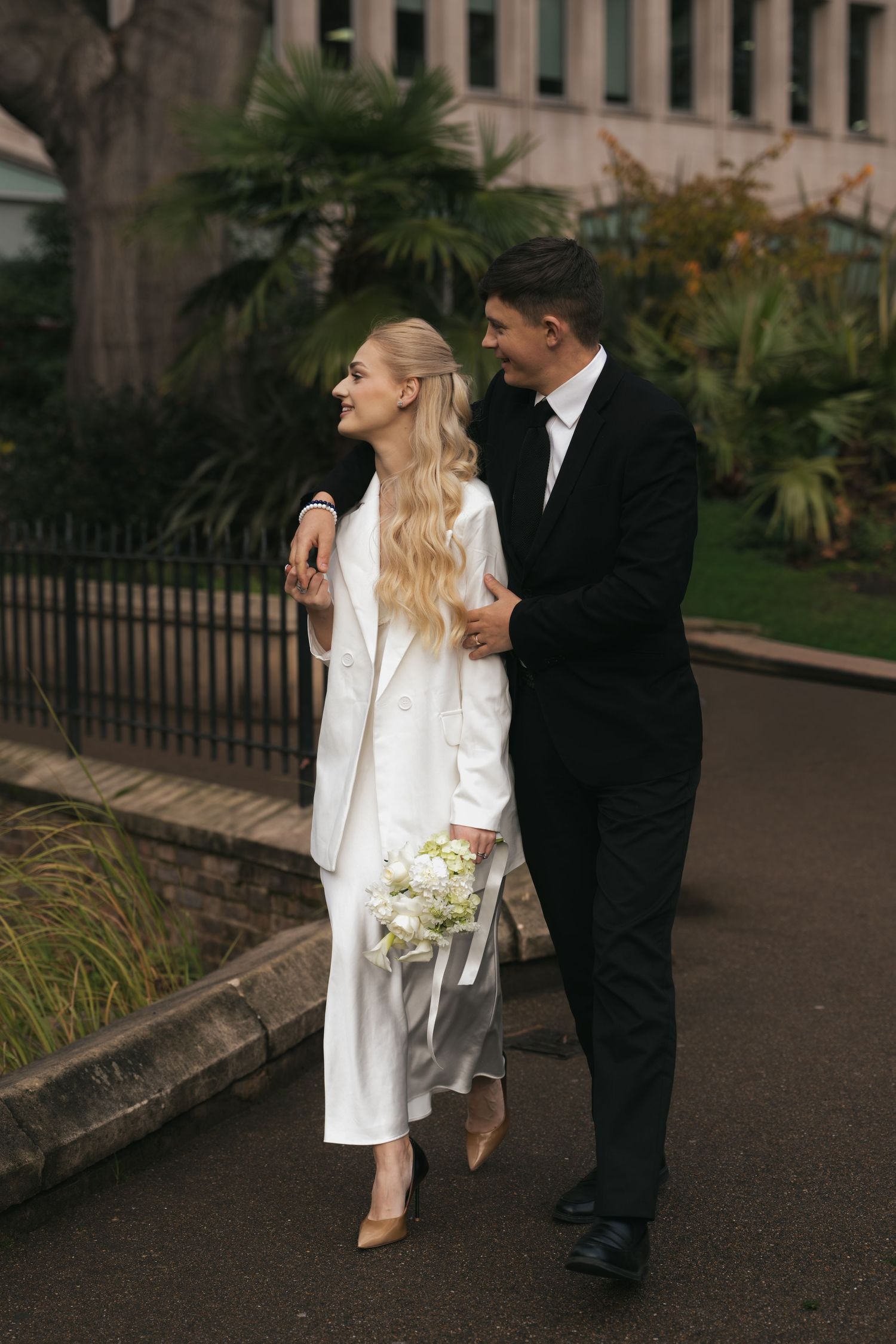“Couple photographed in Victoria Embankment Gardens during a London city session.”