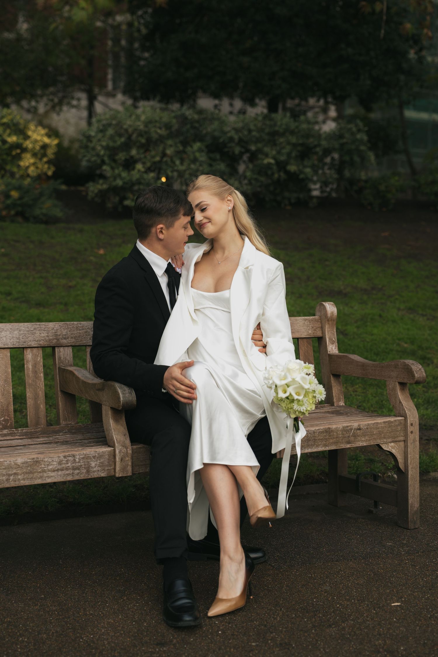 “Couple photographed in Victoria Embankment Gardens during a London city session.”