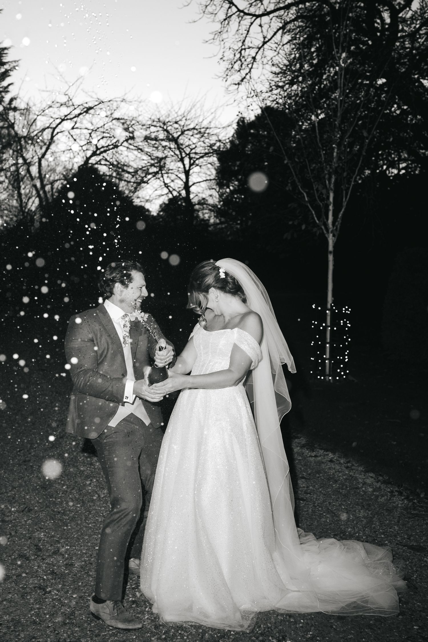 Wedding champagne spray celebration at South Farm editorial shoot captured by @lyfphotos