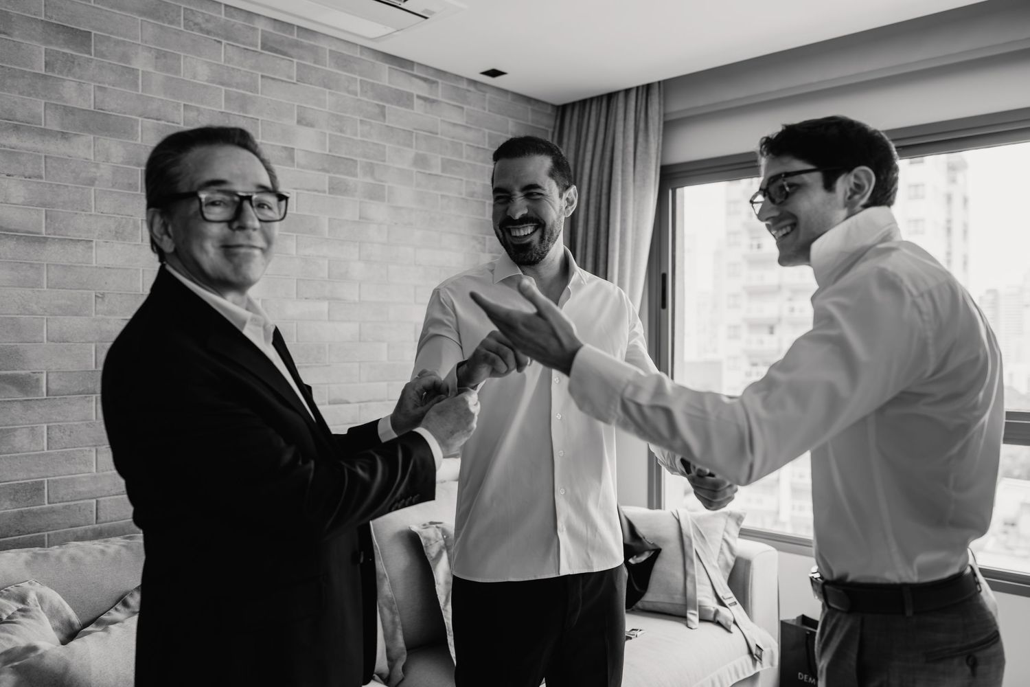 Groom getting ready with father and friends before Botânico Quintal wedding in São Paulo, Brazil.